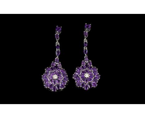 Amethyst Pair of Long Pendant Drop Earrings, 12.25cts; each of the spectacular earrings comprising a double row rosette of ri