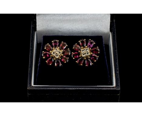 Ladies Attractive Pair of 9ct Gold Amethyst and Diamond Set Earrings in a circular flower head design. The central diamonds s