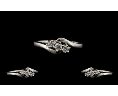 18ct White Gold Nice Quality and Attractive 3 Stone Diamond Set Ring. Contemporary Setting. Full Hallmark For 750 - 18ct. The