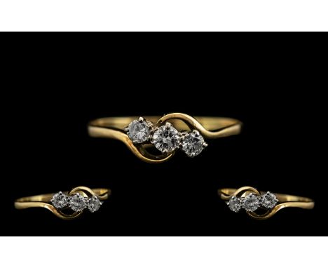 18ct Gold Attractive 3 Stone Diamond Ring the round brilliant cut diamonds of good colour. Est diamond weight 0.25 pts. Ring 