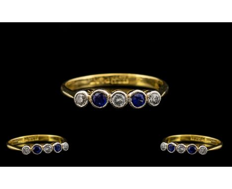 Art Deco Period - Attractive 18ct Gold and Platinum 5 Stone Diamond and Sapphire Set Period Ring From the 1920's. Marked 18ct