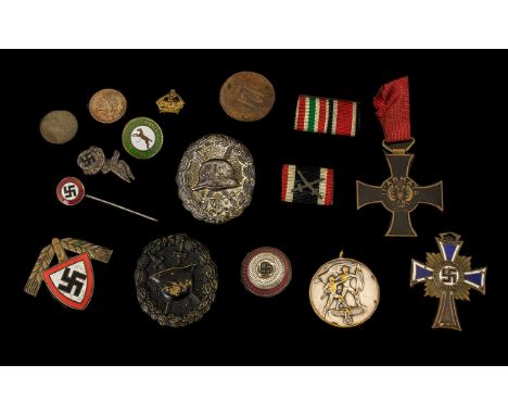 Mixed Lot Of German WW2 Badges To Include A German RAD Labour Corps Cap Badge, Two Wound Badges, Cross of Honour of the Germa