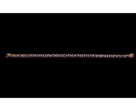 Rose de France Amethyst Tennis Bracelet, a row of oval cut Rose de France amethysts, totalling 12cts, set in rose gold vermei