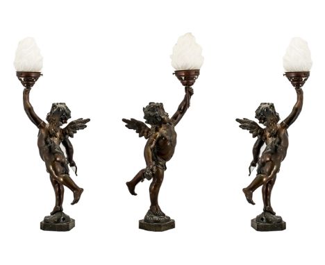 Antique Bronzed Spelter Winged Putti/Cupid Figure converted into a lamp and mounted on a marble base.  Complete with a glass 