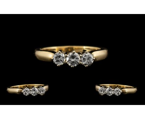 18ct Gold Attractive 3 Stone Diamond Set Ring marked 18ct Gold.  The three round brilliant cut diamonds of good colour and sp