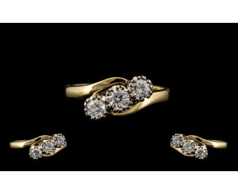 18ct Yellow and White Gold 3 Stone Diamond Set Ring of Excellent Design and Form. Fully Hallmarked for 750 - 18ct. The 3 Roun