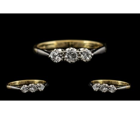 18ct Gold - Attractive 3 Stone Diamond Set Dress Ring. Marked 18ct Gold. c.1950's. The Three Diamonds of Good Colour and Clar