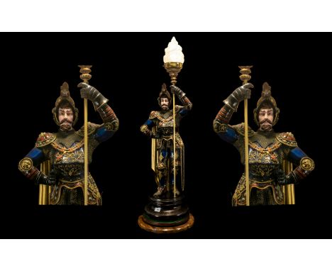 A Large Mid Century Table Lamp realistically modelled and painted in the form of a Medieval knight. Later raised on a wooden 