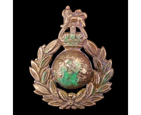 A Royal Marine Cap badge with affixed miniature compass