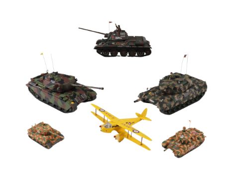 Five Tamiya model tanks and an aeroplane