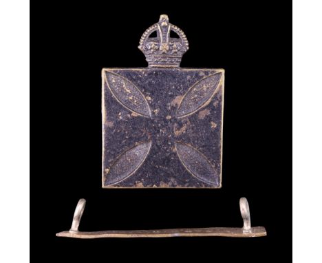 A Royal Army Chaplains' Department cap badge together with a Wounded Strip