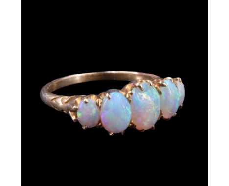 An early 20th Century five-stone opal ring, comprising graded oval stones claw-set between the scroll shoulders of an 18 ct g