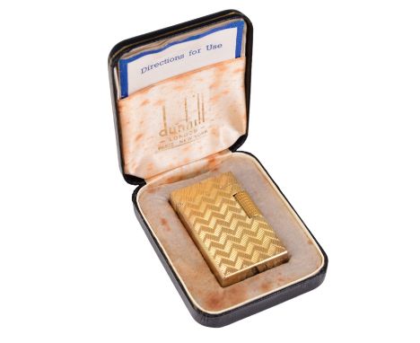 A vintage Dunhill Elite gold-plated petrol cigarette lighter in the original case, third quarter 20th Century