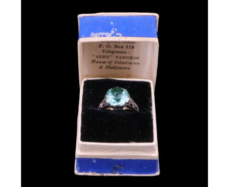 A vintage blue-green stone solitaire ring, the round-cut stone of approx 10 mm, claw-set on a silver heart gallery between th