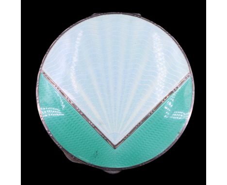 A 1940s Art Deco-influenced enamelled silver powder compact, the cover having a geometric design incorporating an eau de nil 