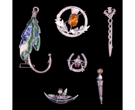 A group of vintage silver and white-metal Scottish influenced brooches together with a kilt pin, 49 g
