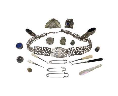 A group of electroplate and similar dressing accessories including a belt, a Stratton powder compact, pin cushions and button