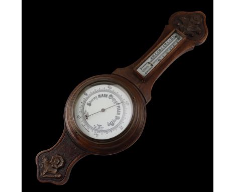An early 20th Century carved oak banjo barometer, 71 cm