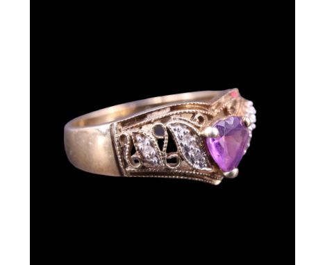 An amethyst and diamond wishbone ring, comprising a heart-shaped amethyst set between pairs of diamond-set precious white met