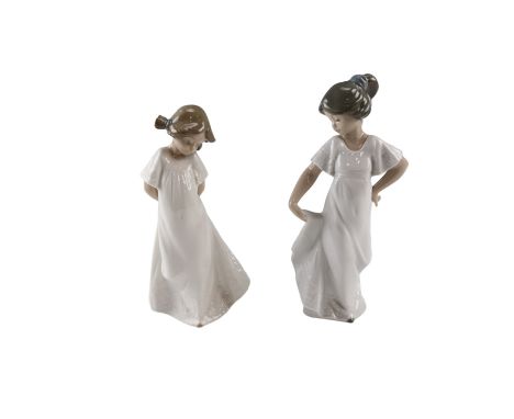 Two Nao figurines of young girls, tallest 22 cm