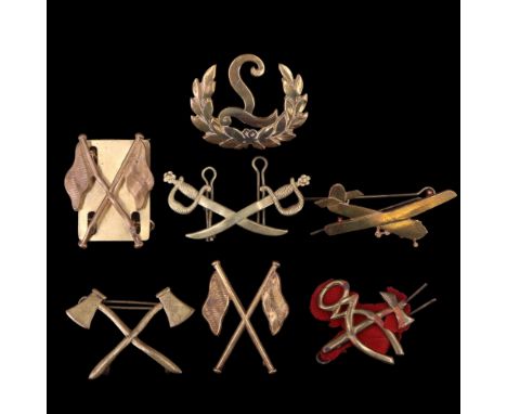 A small group of British Army trade and qualification badges together with a King's Own Royal Border Regiment glider arm badg