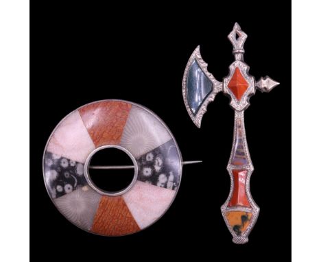 A Victorian Scottish style "pebble" or polished hardstone and silver brooch in the form of a battle axe, bearing a Design Reg