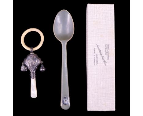 A 1920s silver-mounted mother-of-pearl rattle and teether together with a horn christening spoon having an applied shield-sha