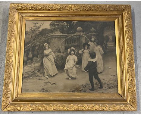 A late Victorian Arthur J Elsley print of children skipping, in a gold painted frame with clover leaf detail. Named &amp; dat