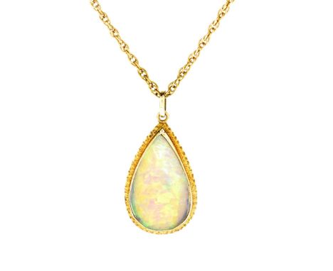 Vintage Pear Shape Opal and 14 Karat Yellow Gold Pendant Necklace. Clasp stamped 14K. Opal with good play of multi color. Pen