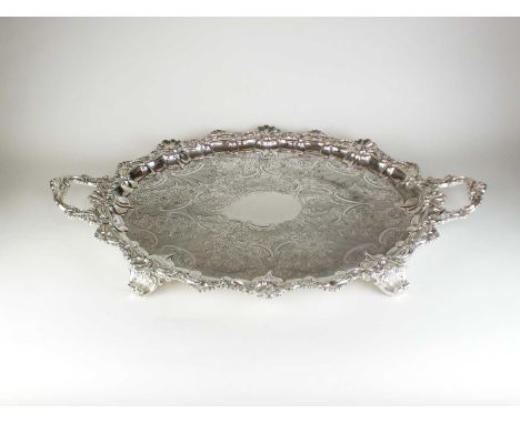 An impressive Victorian two handled silver tray, John Round &amp; Son Ltd, Sheffield 1898, of oval form with chased scroll an