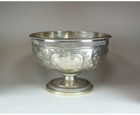 A George III pedestal bowl by Paul Storr, London 1804, of circular form with gadrooned rim and later embossed decoration and 
