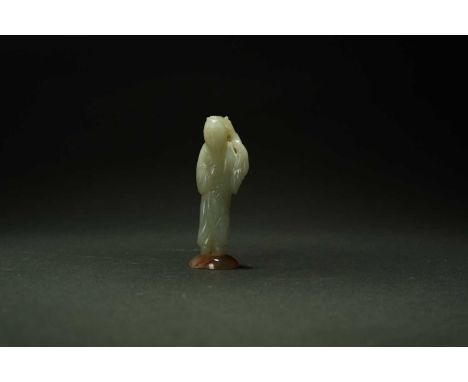 Two Chinese jade figures, 19th centuryThe first near white and probably depicting Guanyin in flowing robes and holding a bott