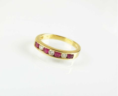 An 18ct gold seven stone ruby and diamond half eternity ring, designed as a row of four round mixed cut rubies and three bril