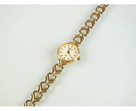 A 9ct gold ladies Rotary bracelet wristwatch, the white dial with gold batons and with attached 9ct gold bracelet, total weig