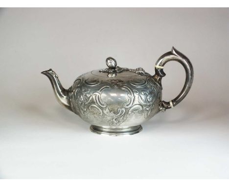 An early Victorian silver teapot, William Moulson, London 1848, of circular form with chased scroll and floral decoration and