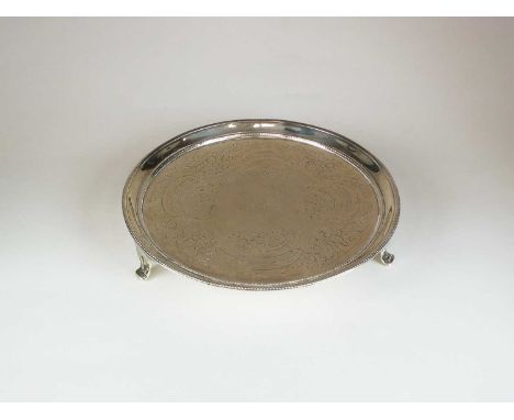 A George III silver waiter, Daniel Smith &amp; Robert Sharp, London 1780, of circular form with chased decoration and engrave
