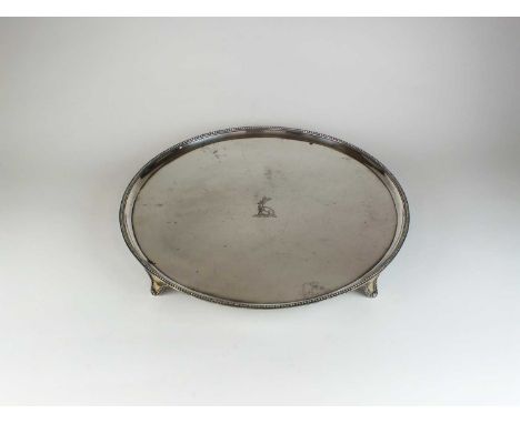 A George III silver salver, John Crouch I &amp; Thomas Hannam, London 1785, of circular form with engraved crest to the centr