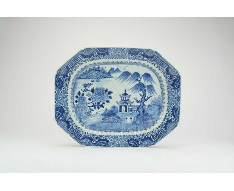 Three Chinese blue and white oval platters, 18th centuryOf canted form, each decorated with villas and flowering plants besid