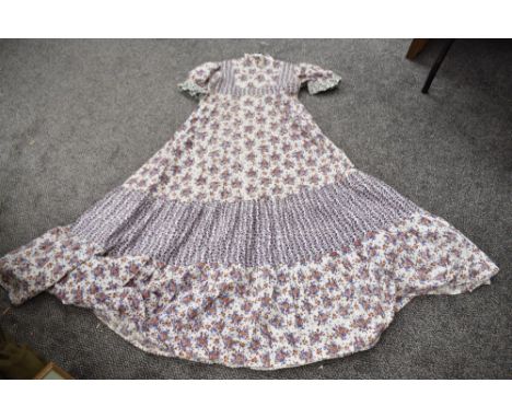 A vintage cotton 1970s tiered dress having high neck and puffed sleeves approx size 8/10.