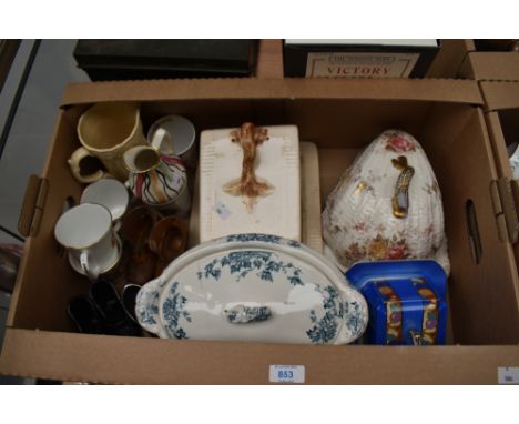 A vintage cheese dish having bough handle and stippled stag decoration to sides sold along with a similar shell shaped cheese