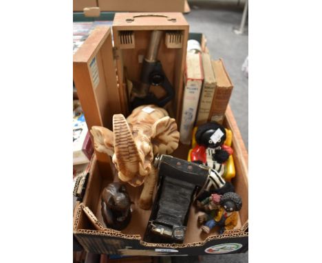 A vintage Enuro Optik microscope in wooden case, an elephant study, a cast figurine in the style of 'The Thinker, three vinta