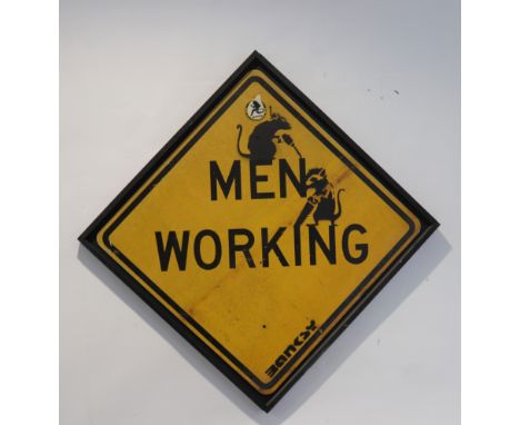  Banksy. â€œMen Workingâ€. Black spray on yellow road sign. Signed "Banksy" lower right. From: Liverpool, UK. - Sizes: H: 117