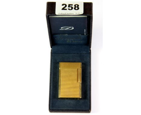 A boxed Dupont gold plated lighter.