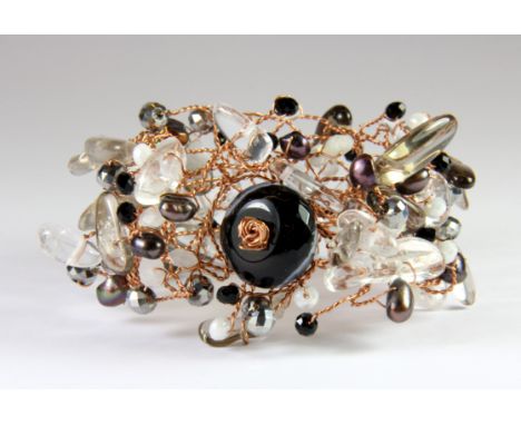 A stunning pearl, rock crystal and banded agate on copper wire bangle, designed by Leo.