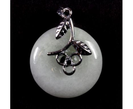 A white metal mounted carved jade disc pendant, L. 3.5cm.