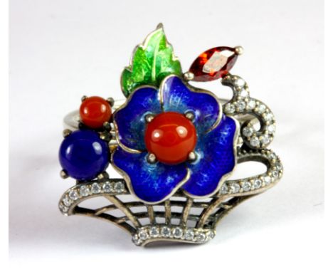 A white metal (tested silver) enamel hinge ring set with lapis lazuli, cornelian and garnet (Q).