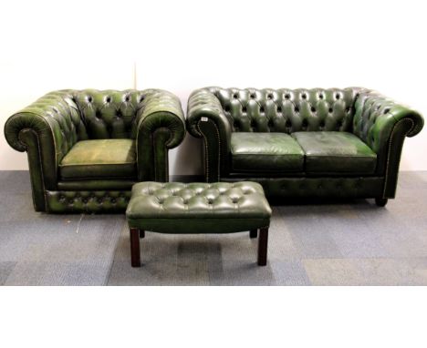 A two seater green leather button backed Chesterfield settee with matching armchair and footstool.