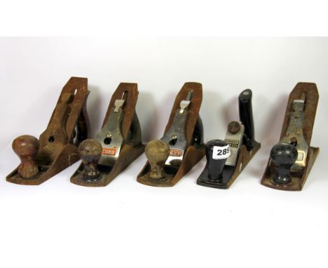 Five vintage wood working planes.