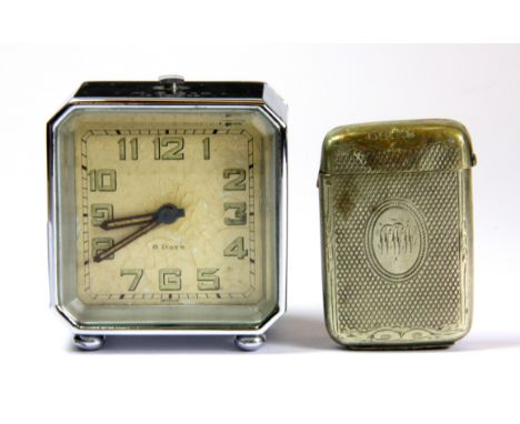 A small Art Deco alarm clock and a silver plated vesta case.