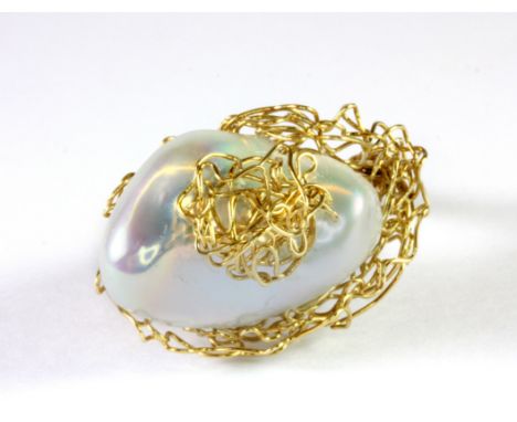 A unique yellow metal (tested min 9ct gold) and baroque pearl ring by Leo (Q).